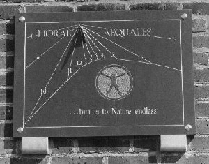 Figure 16 (right): One of a matched pair of dials above the entrance to the Bennett Building of Leicester University.  This on the right shows the time in 'equal' hours